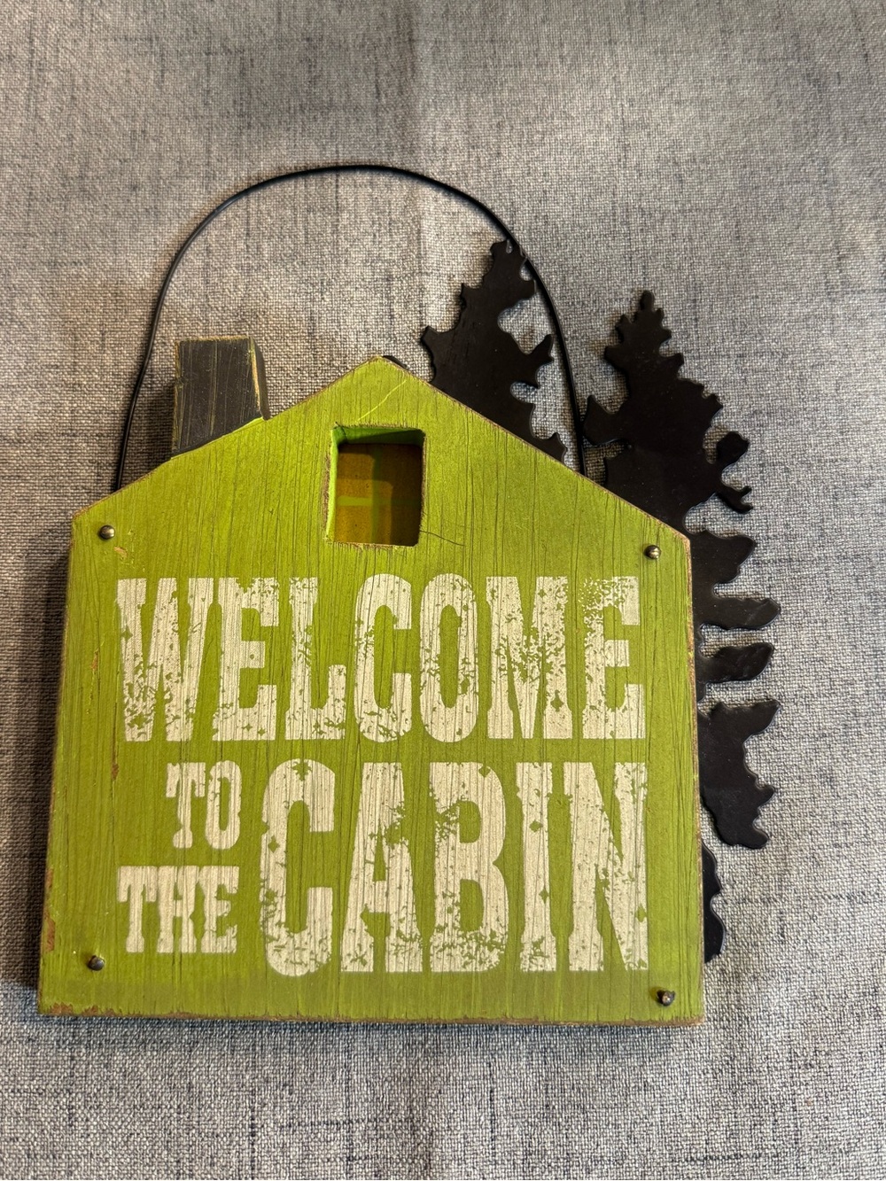Decor wall-hanging sign with a‎ "Welcome to the Cabin". Green black.